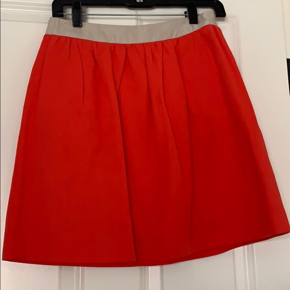 Red pleated skirt